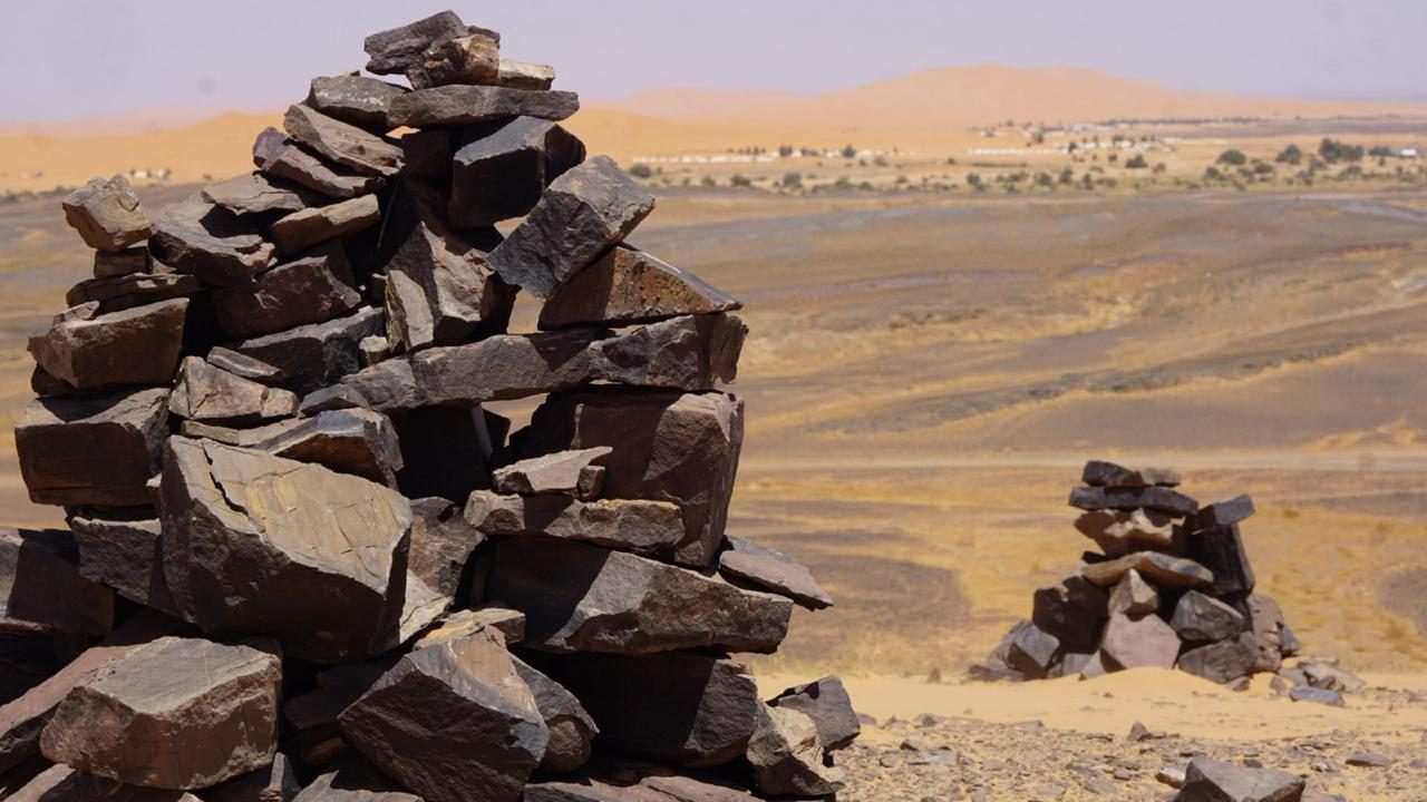 Stone cairns marking the trail in the Sahara near Merzouga