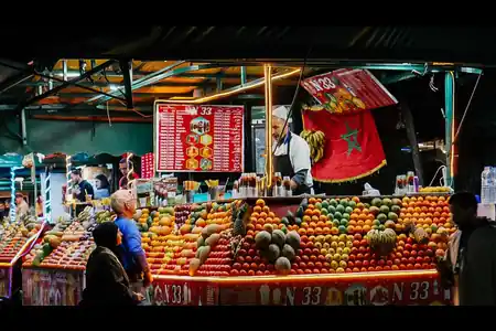 Fresh juice stall lit up at night on Jemaa el-Fna square in Marrakech